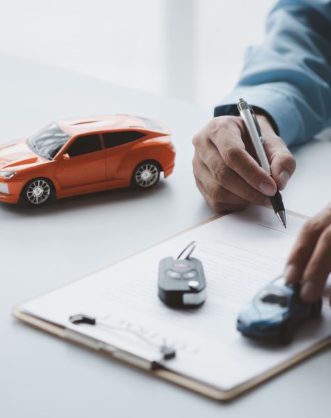 young-couple-talking-sales-person-car-showroom-01 (1)